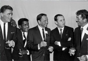 The Rat Pack enjoy a drink and a laugh together.